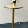 brass cocktail bar table with white marble top.